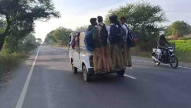 School students doing stunts by hanging from auto, watch video