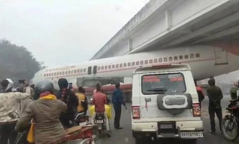 Airplane stuck under overbridge, crowd gathered to see the sight, see VIDEO