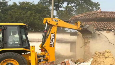 Bulldozer runs on illegal house of Panchayat Secretary