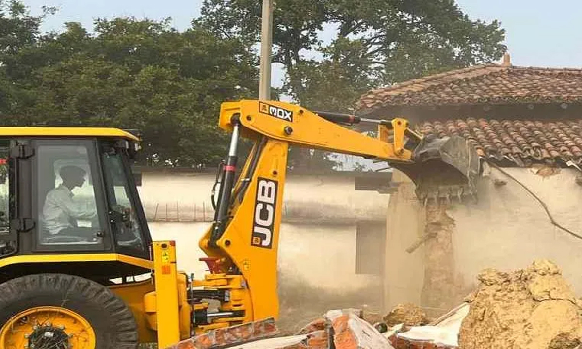 Bulldozer runs on illegal house of Panchayat Secretary