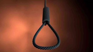 Middle aged man committed suicide by hanging himself from a tree